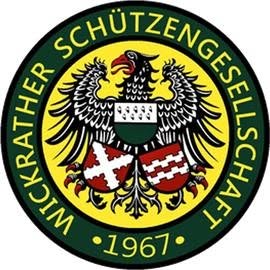 Circular emblem of a German shooting club, featuring a black eagle, a shield, and the year 1967 surrounded by a green border with yellow text